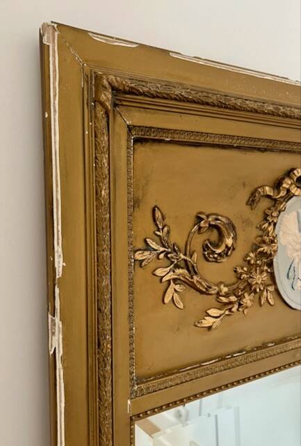 Antique gilded trumeau mirror in Louis XVI style