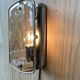 Brass wall lamp and smoked glass