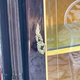 Mahogany display case with gilded brass decoration