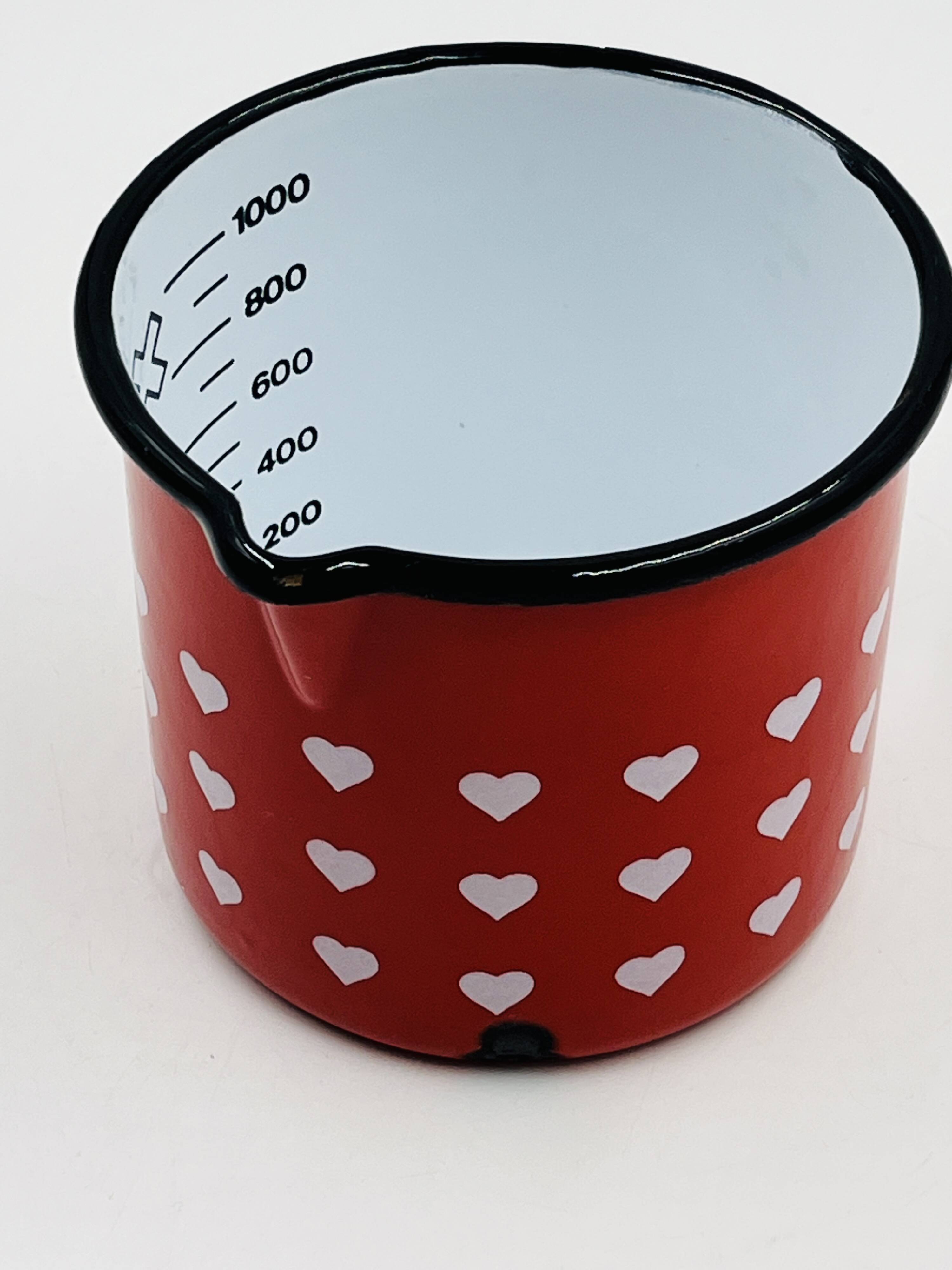 Vintage red enamelled measuring jug with hearts
