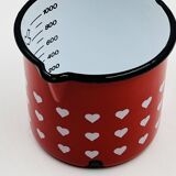 Vintage red enamelled measuring jug with hearts