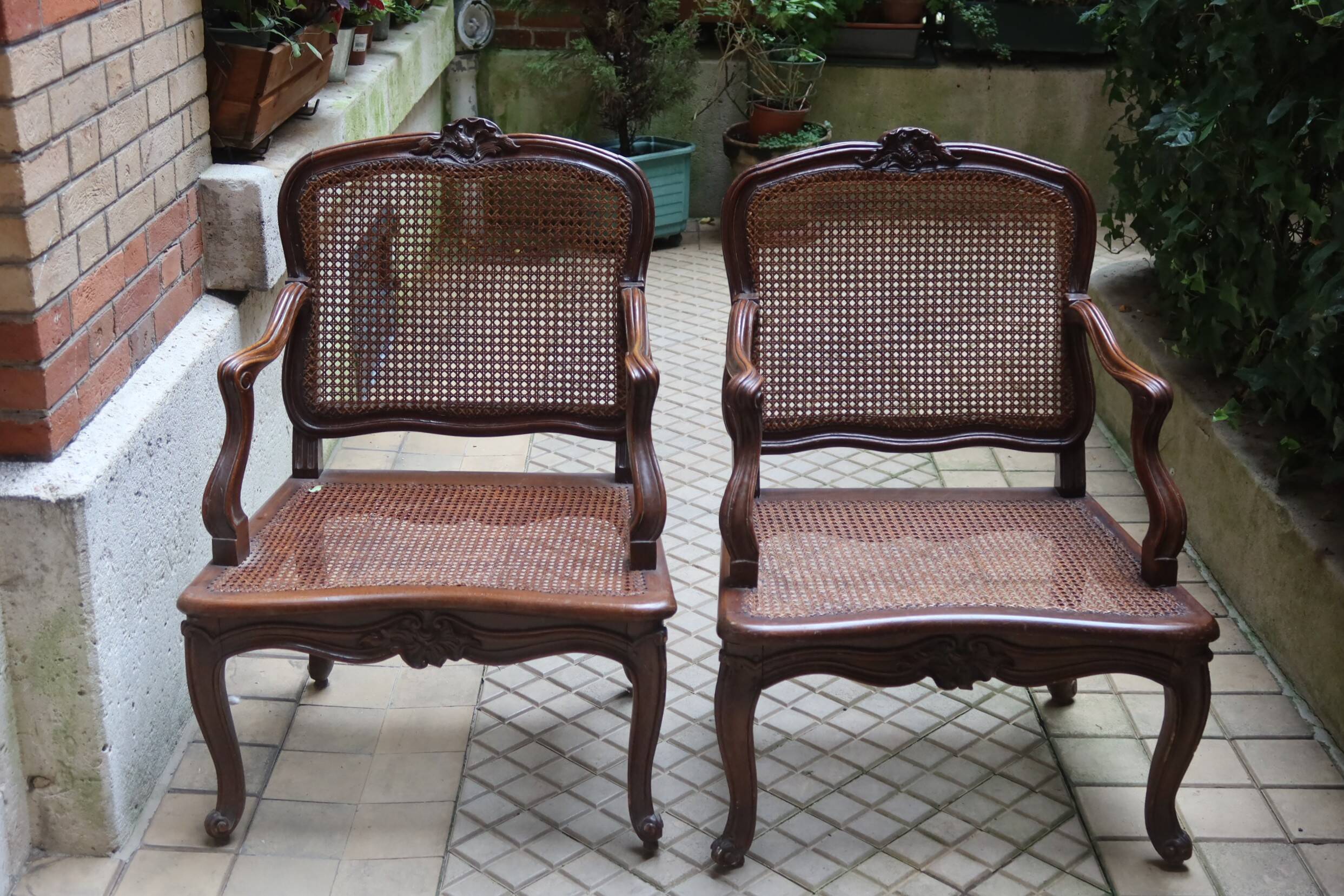 Pair of Louis XV style armchairs in wood and caning.