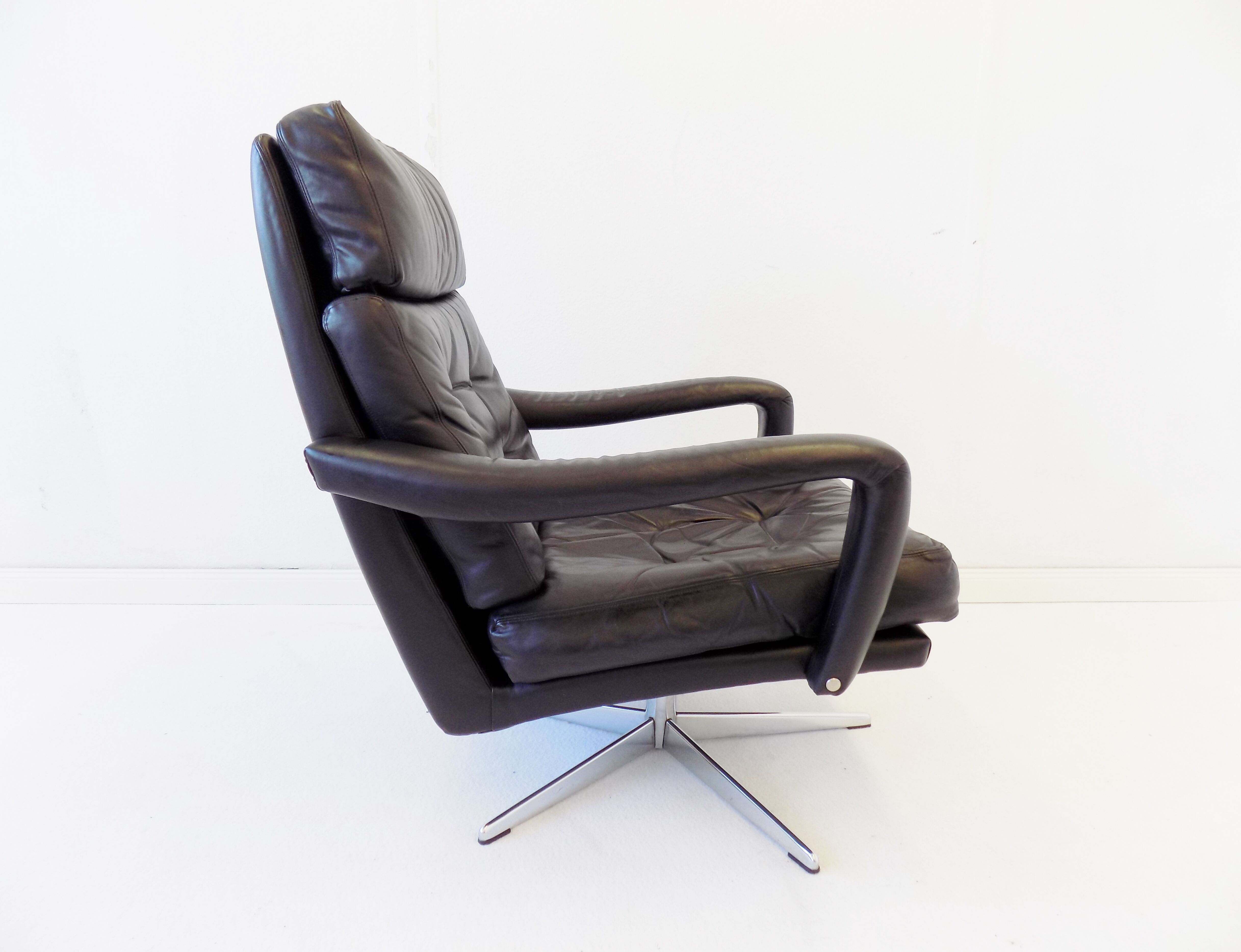 Danish black leather armchair with ottoman 70s