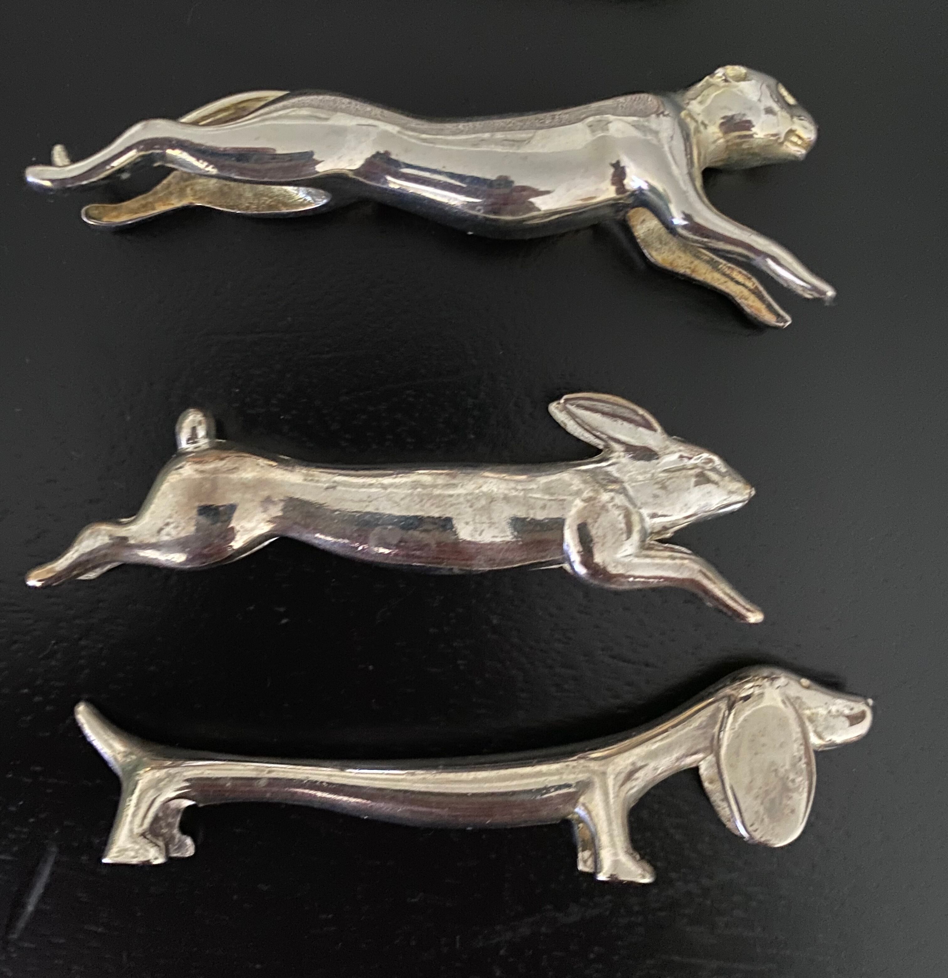 12 knife holders form various metal animals