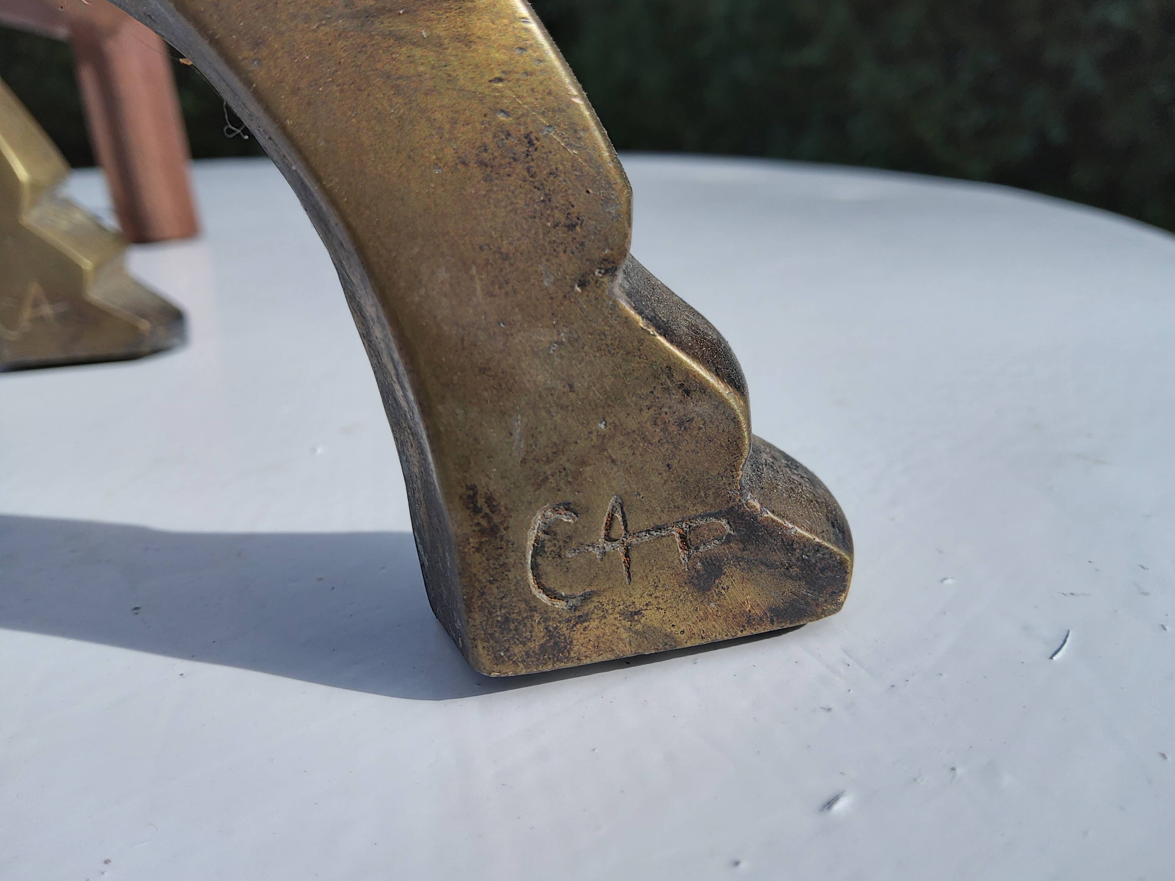 CAP monogrammed andirons