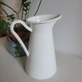 White enamelled metal jug