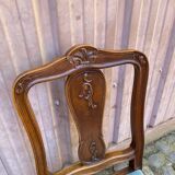 Vintage Louis XV chair made of carved solid wood with blue velvet fabric.