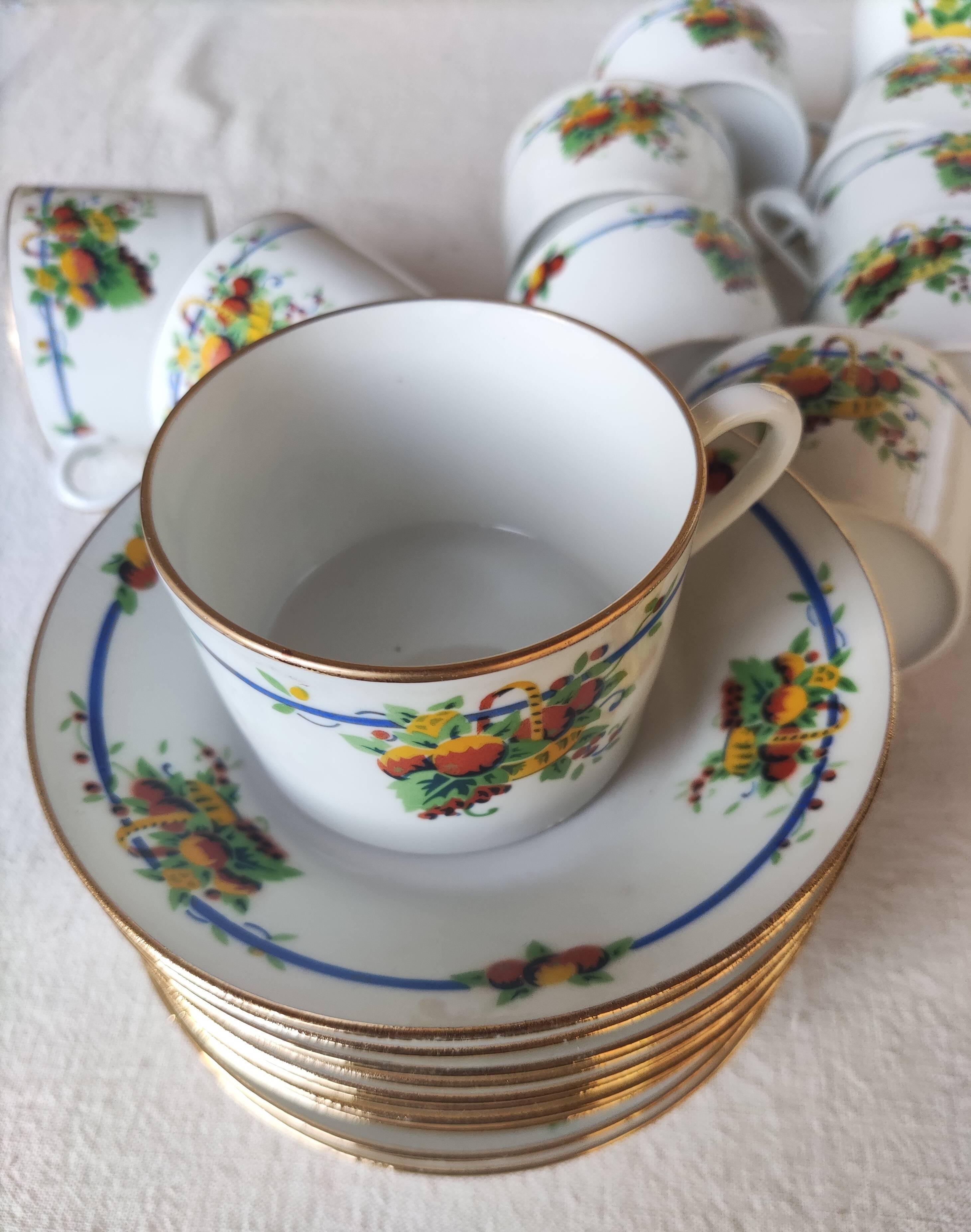 10 tea cups and creamer in Limoges porcelain