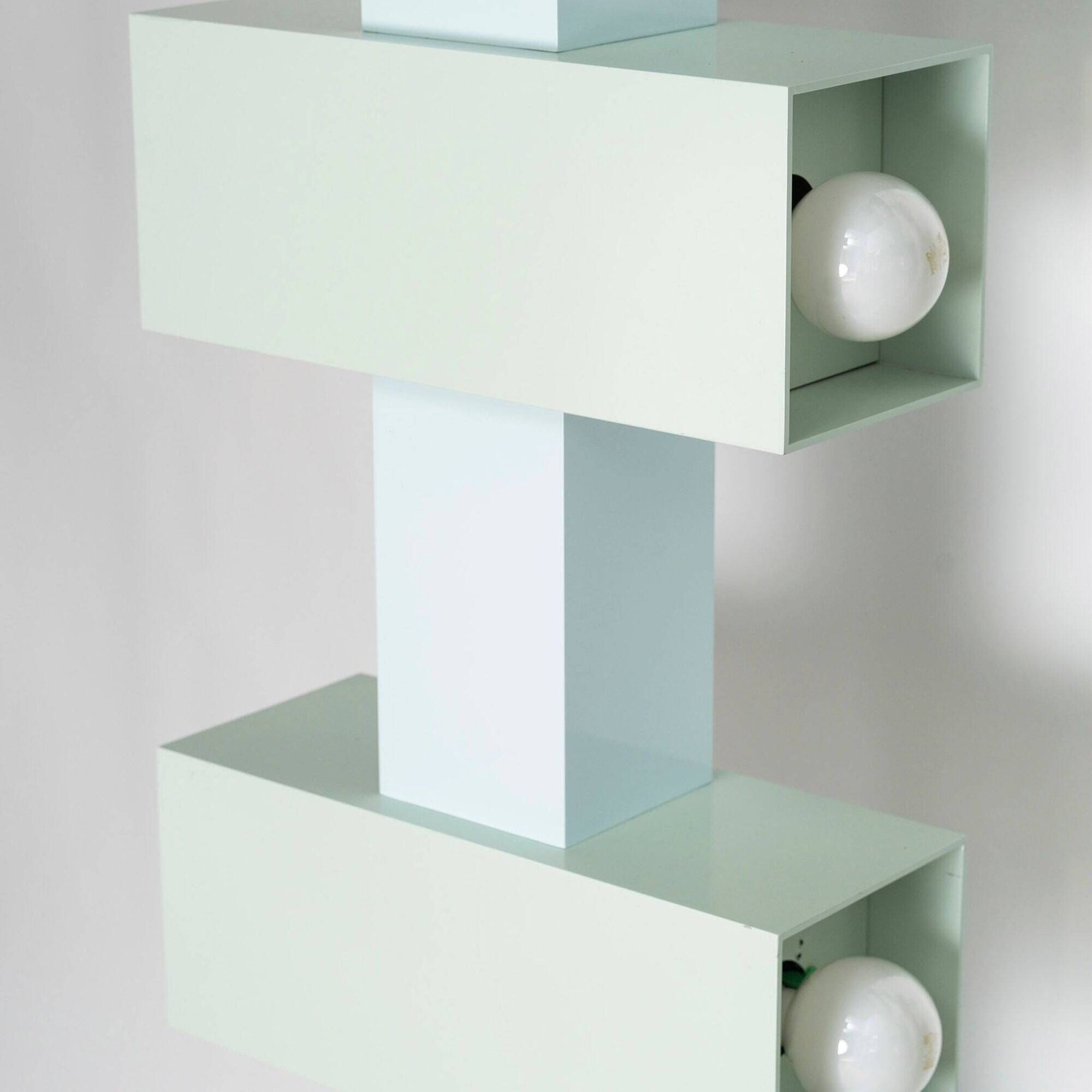Pair of illuminated totems in lacquered steel, Italy, 1990
