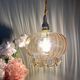 Suspension globe vintage en verre ambré