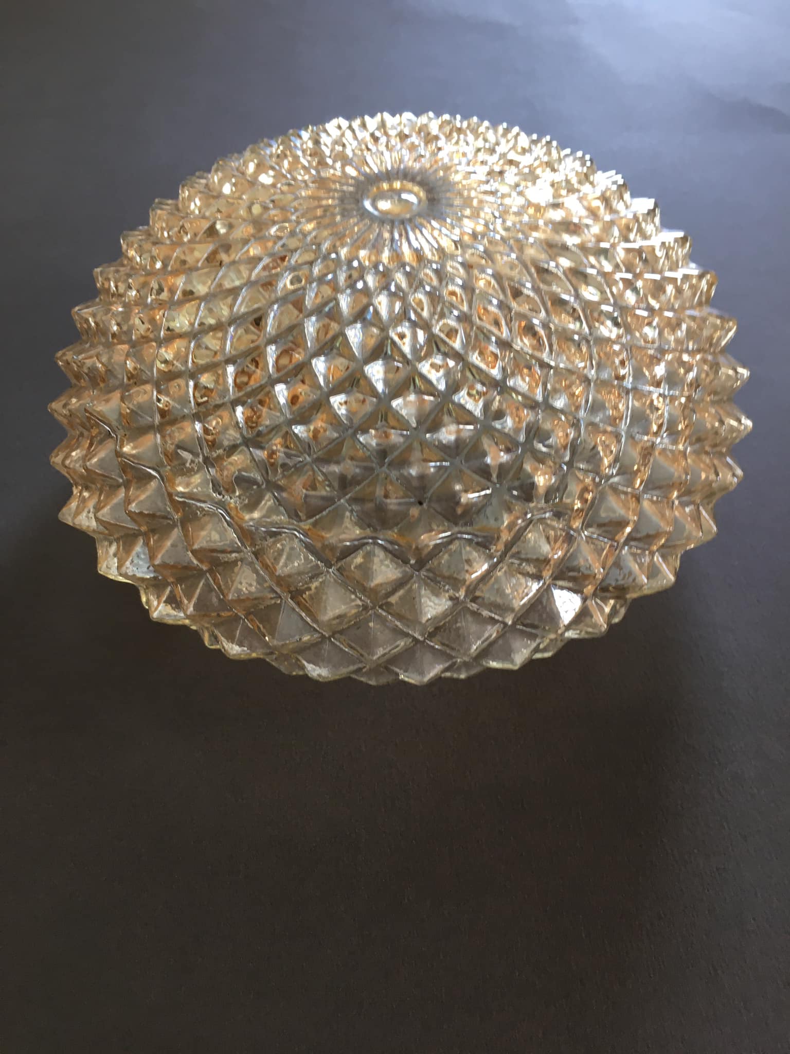 Slightly amber worked glass globe