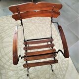 Folding garden chair with teak slats on a wrought iron structure