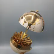 Vintage brass globe cigarette dispenser
