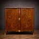Wooden cabinet with doors, richly inlaid with floral patterns, Louis XV style.