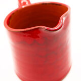 Bright red ceramic pitcher
