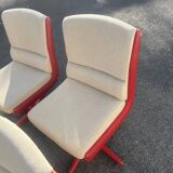 Set of 4 vintage 1970s swivel chairs in red and beige.