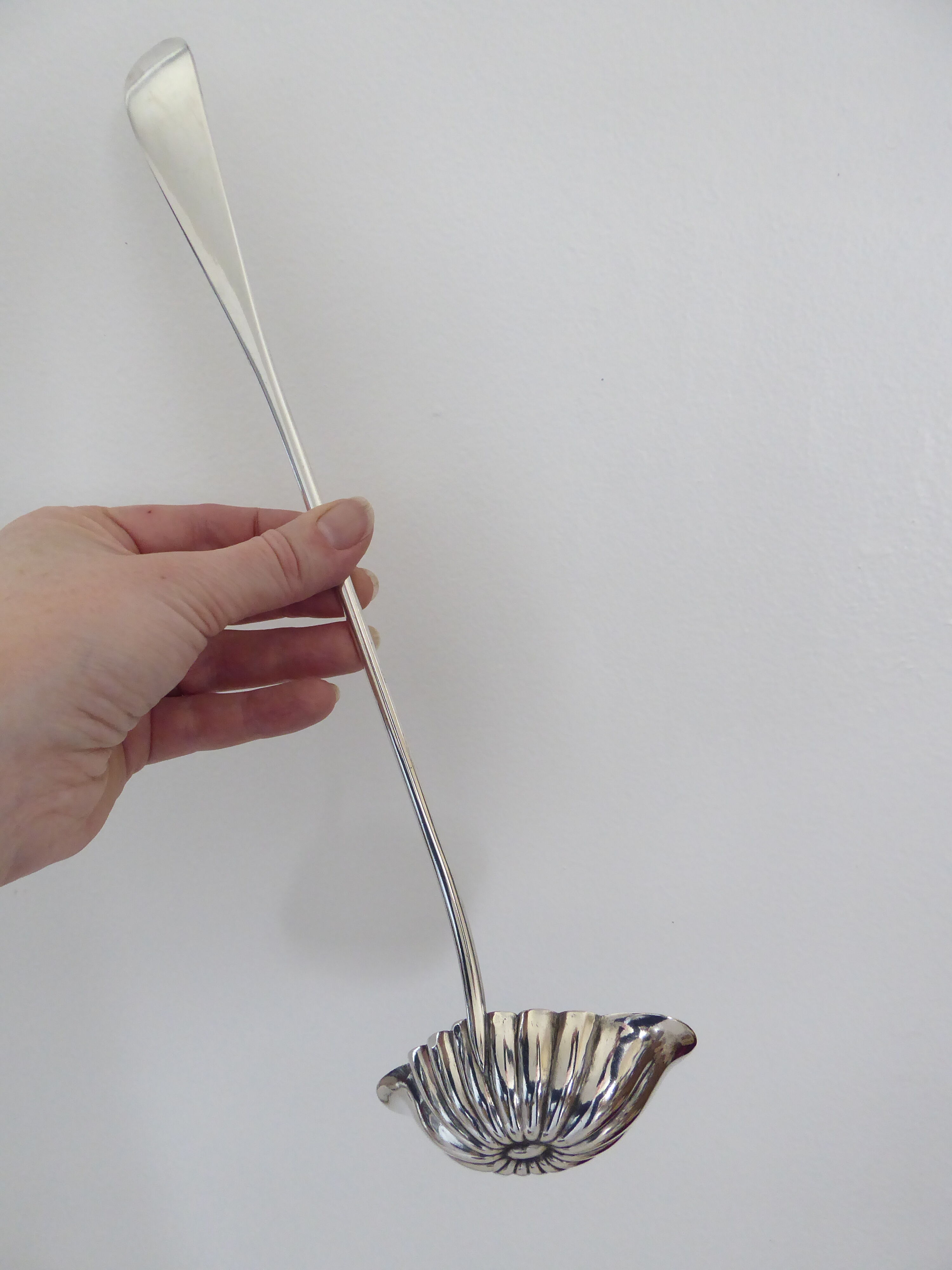 Silver metal sauce ladle