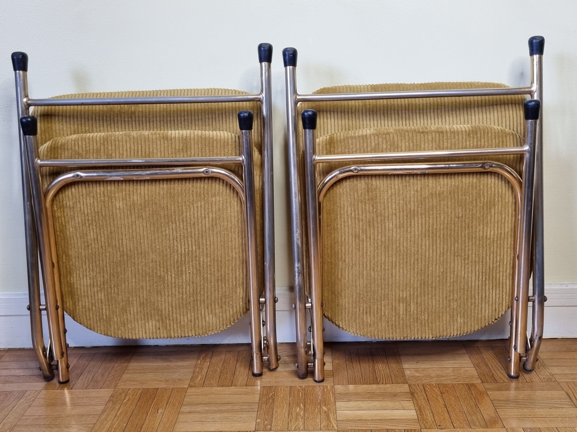 Pair of vintage folding chairs in gilded metal and 70s fabrics, restored