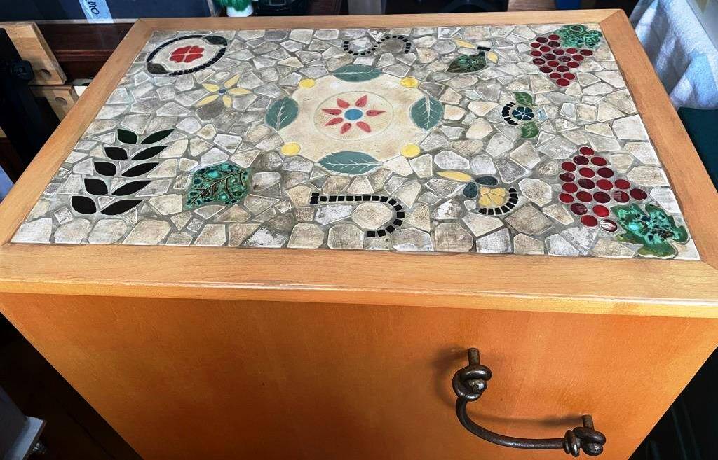 New oak storage furniture with a signed artisanal mosaic top.