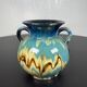Black ball vase with handle, yellow blue marbled