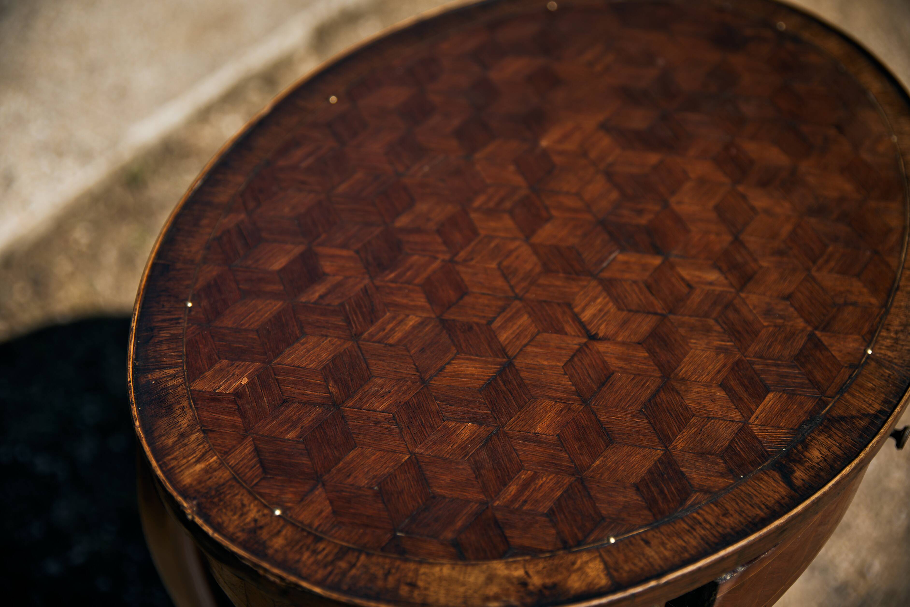 Oval coffee table in cube marquetry and bronze, Louis XV style.
