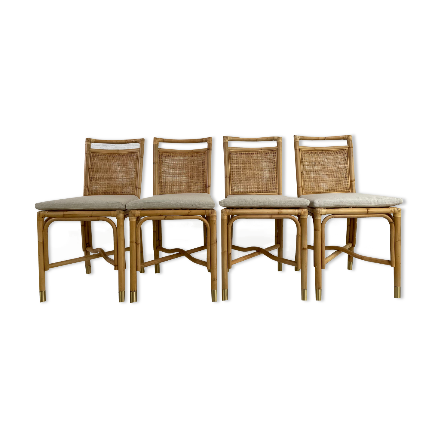 Suite de 4 chaises en rotin cannage et laiton