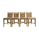 Suite de 4 chaises en rotin cannage et laiton