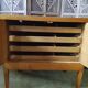 Vintage storage unit with two doors and four drawers.