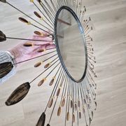 Vintage metal sun mirror in the style of Line Vautrin