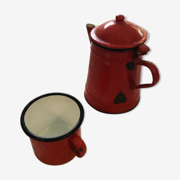 Old pitcher and cup in enamelled sheet metal