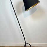 Design floor lamp in black lacquered metal and brass.