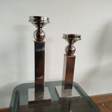 Pair of designer candlesticks in chromed metal.
