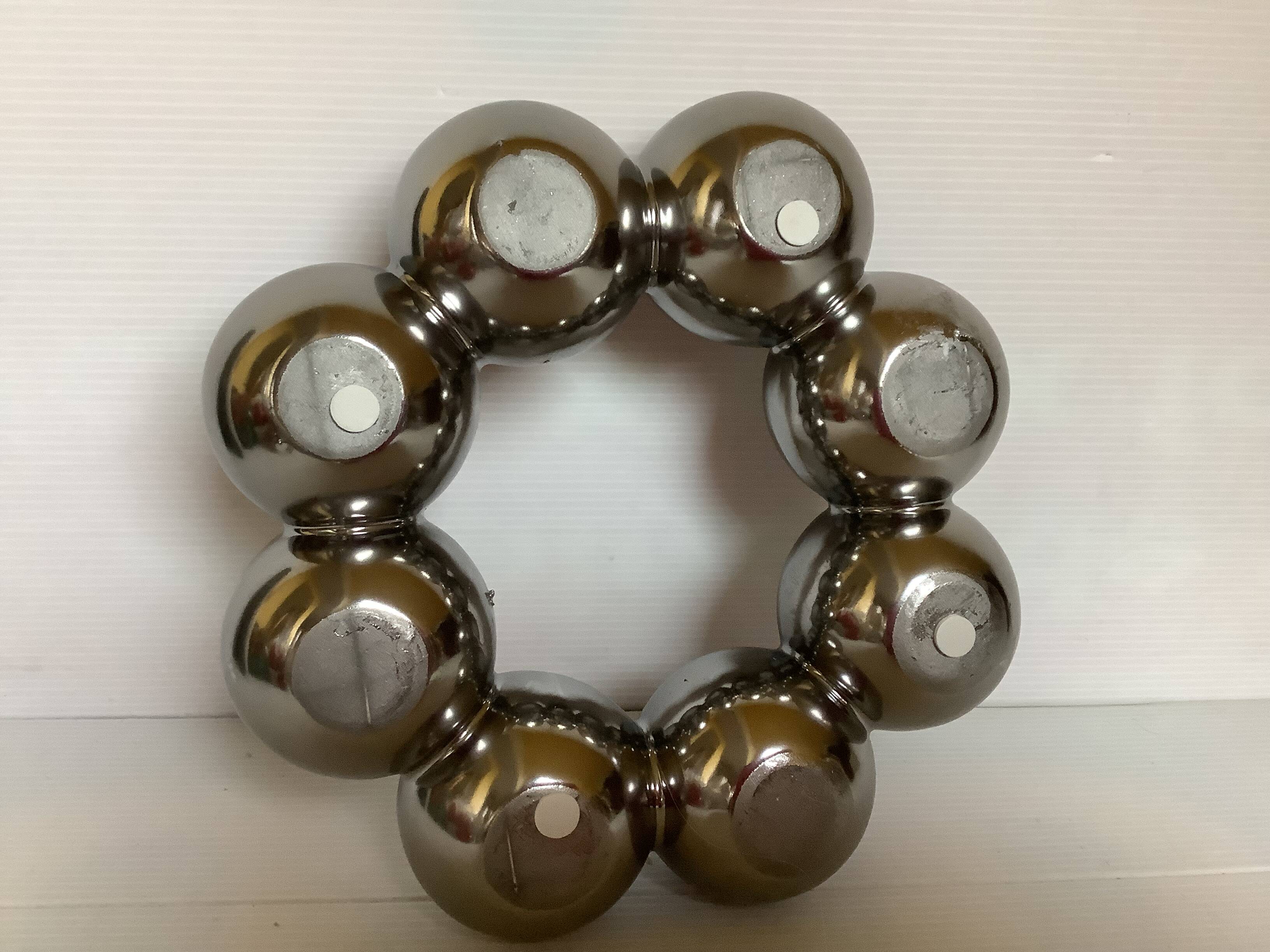 Silver flower vase in a crown shape.