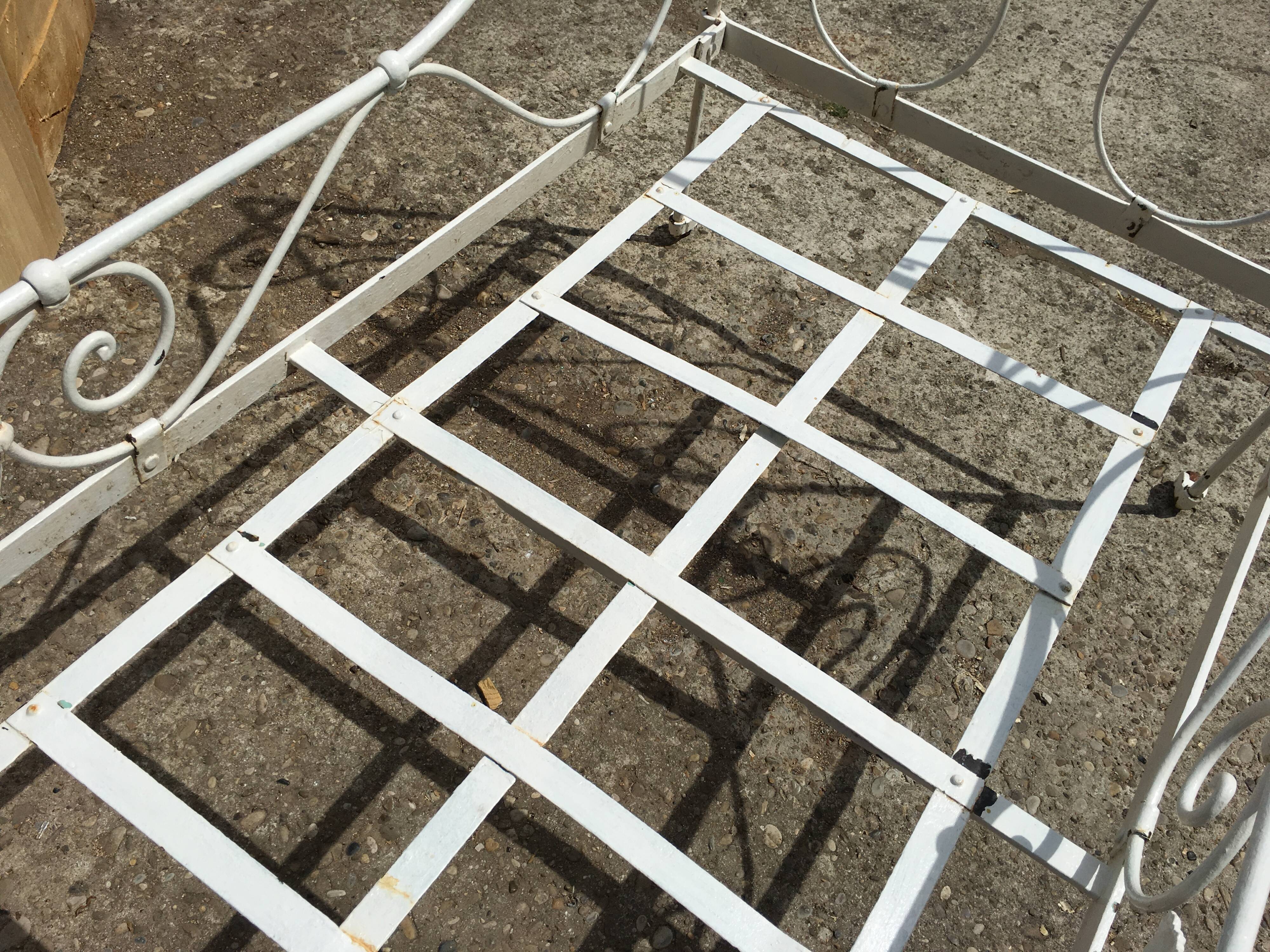 Ancient white metal bed