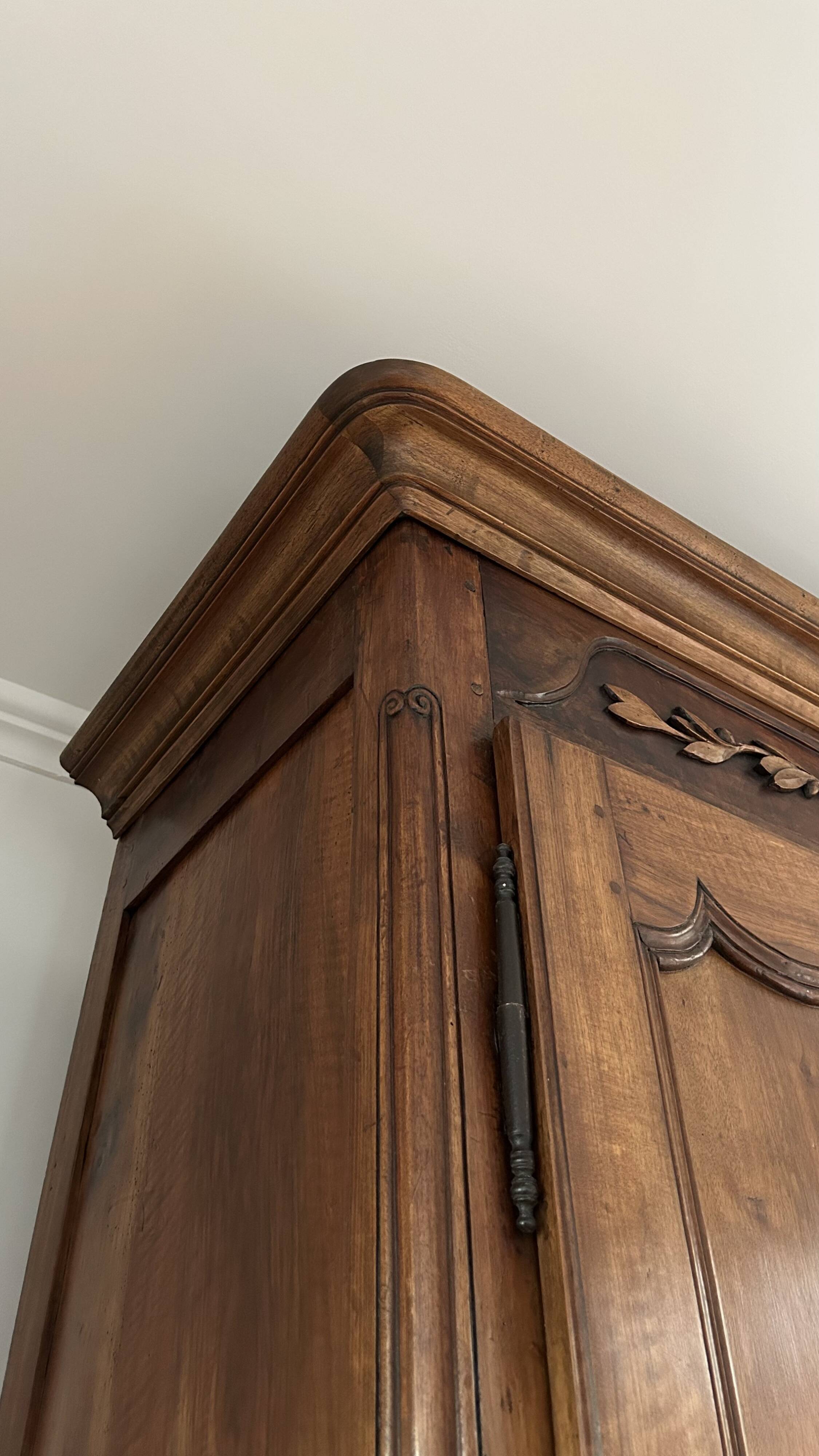 Antique walnut armoire with two doors.