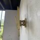 Pair of Regency brass wall lights in Italy