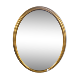 Golden oval mirror