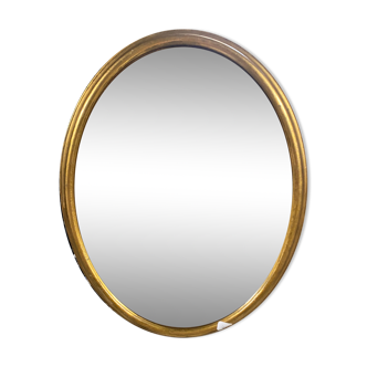 Golden oval mirror
