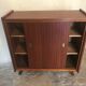 Vintage storage cabinet teak veneer sliding door compass feet