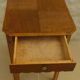 Small art deco style piece of furniture with one drawer and one shelf