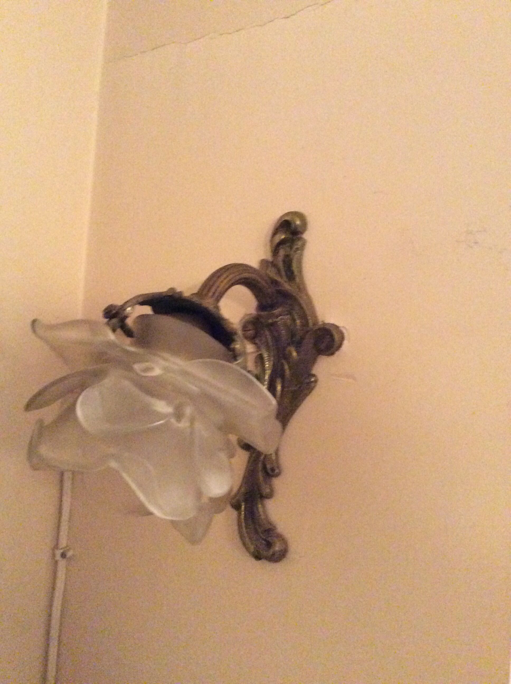 Old wall lamp in bronze and glass