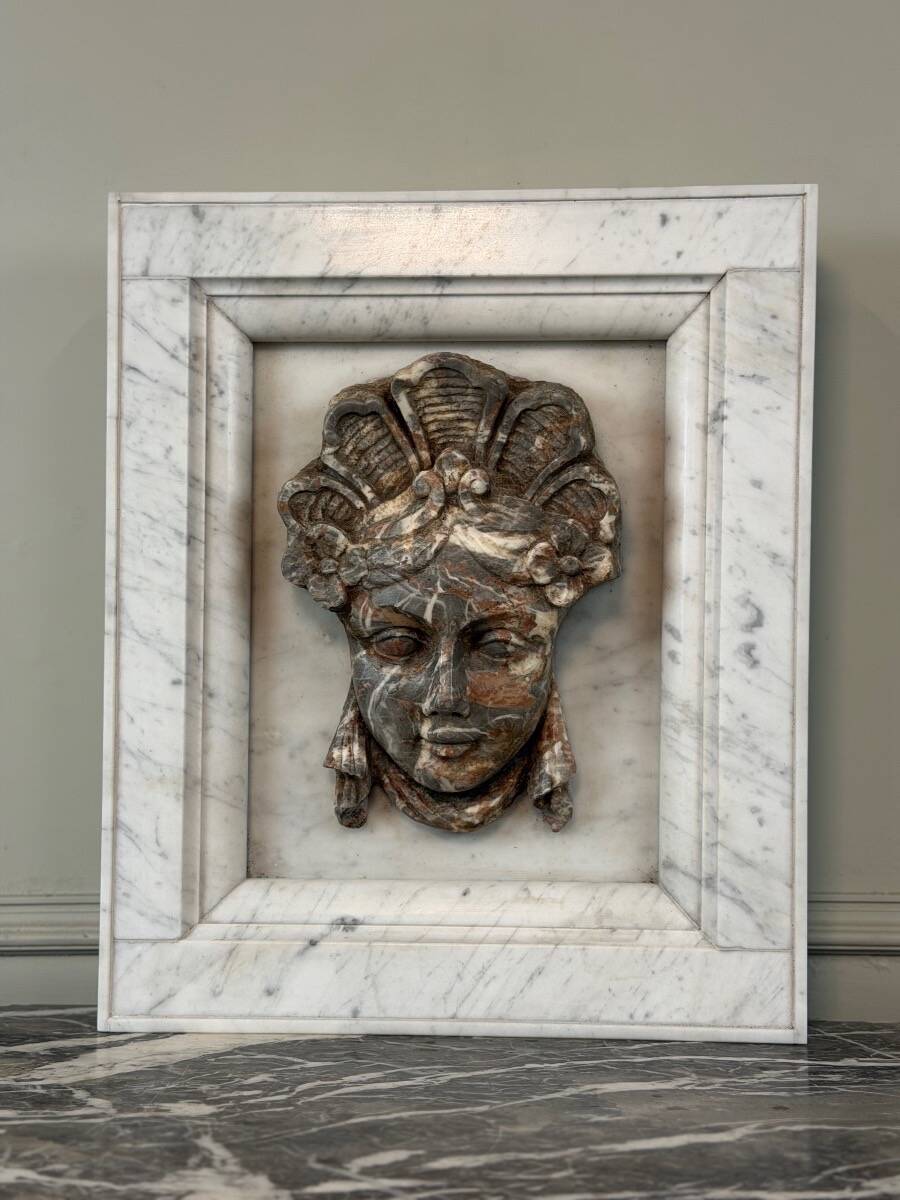 Female mascaron in grey Ardennes marble from the Regency period, 18th century.