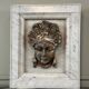 Female mascaron in grey Ardennes marble from the Regency period, 18th century.