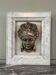 Female mascaron in grey Ardennes marble from the Regency period, 18th century.