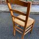 4 solid wood straw-seated Louis Philippe chairs, oak, 20th century.