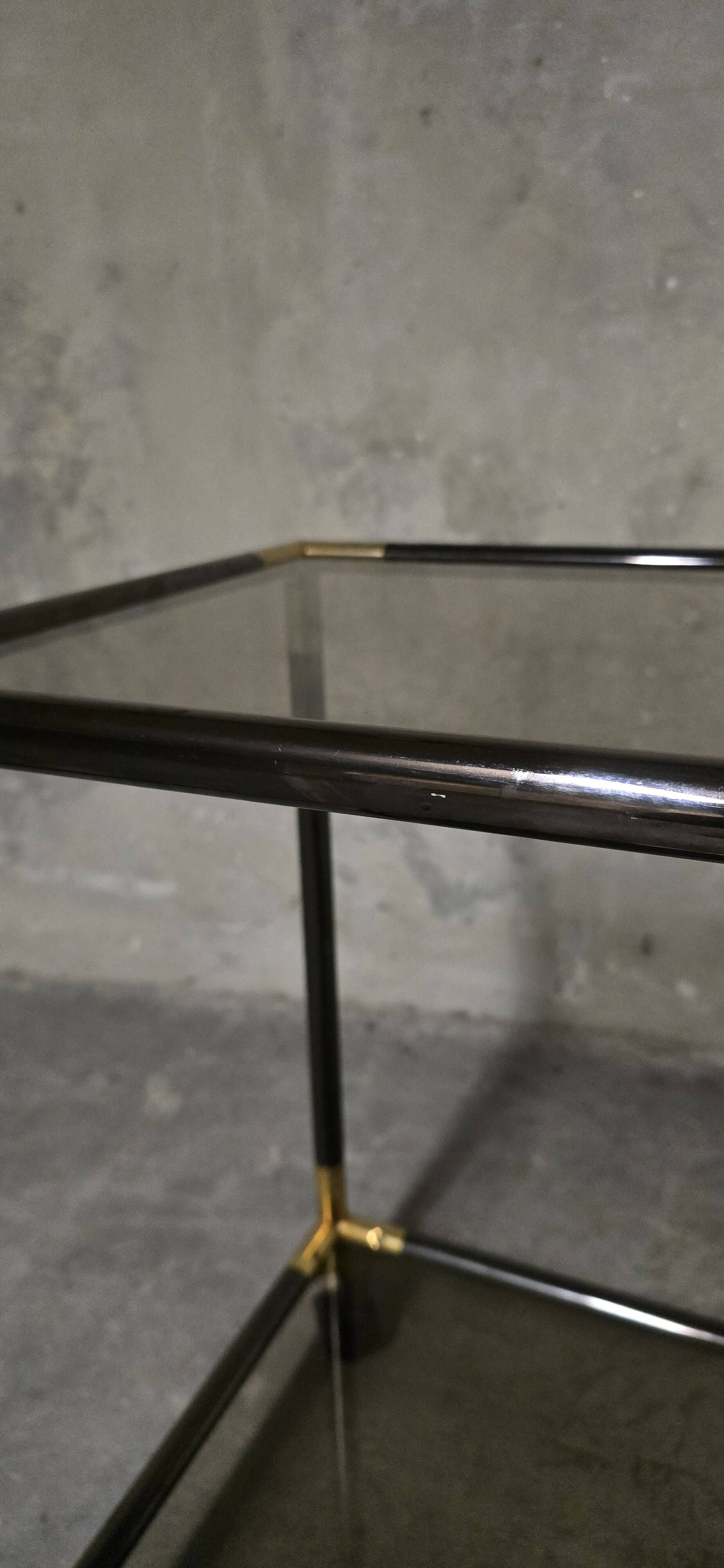Black metal and brass rolling dessert trolley, smoked glass, 1970s.