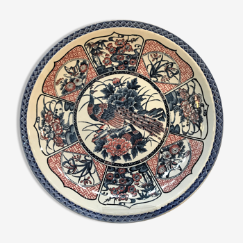 Round ceramic dish with peacock