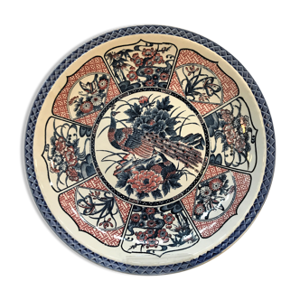 Round ceramic dish with peacock