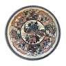 Round ceramic dish with peacock