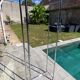 Bauhaus style bookcase with modular wall shelf, glass and chrome